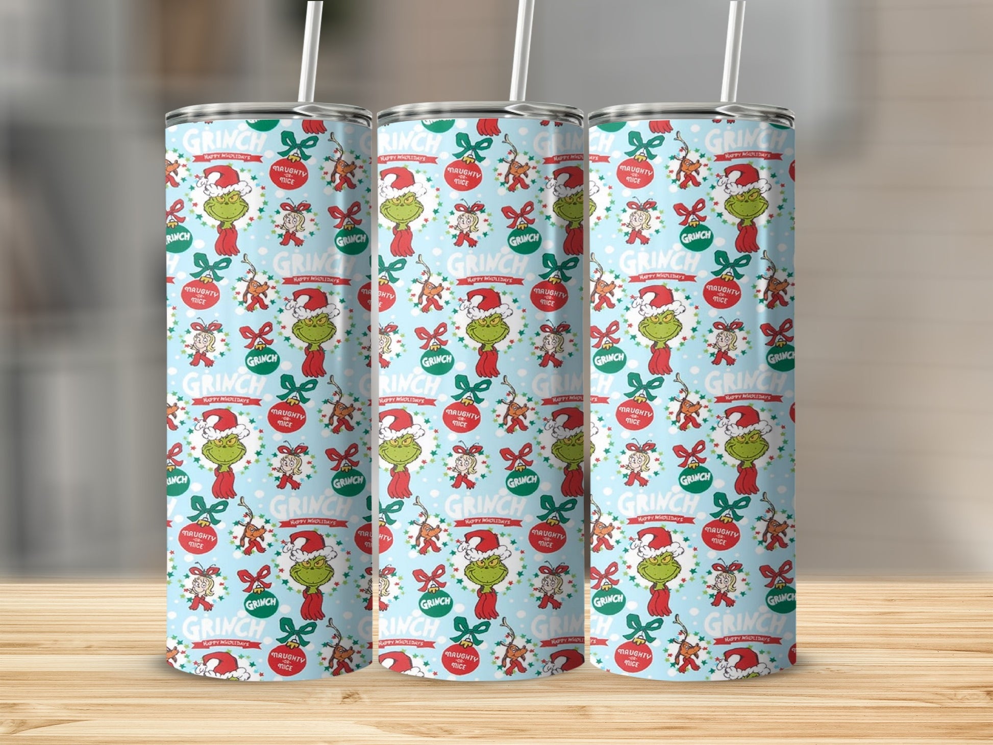 Grinch holiday tumbler with red bow and "Naughty or Nice" text.
