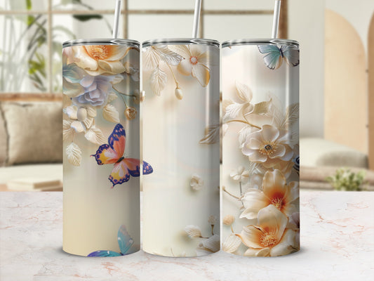 Three tall tumblers with pastel floral and butterfly designs.