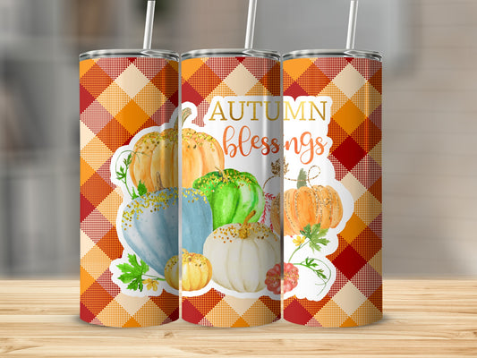 Autumn Blessings tumbler with pumpkins, plaid background, and straw.