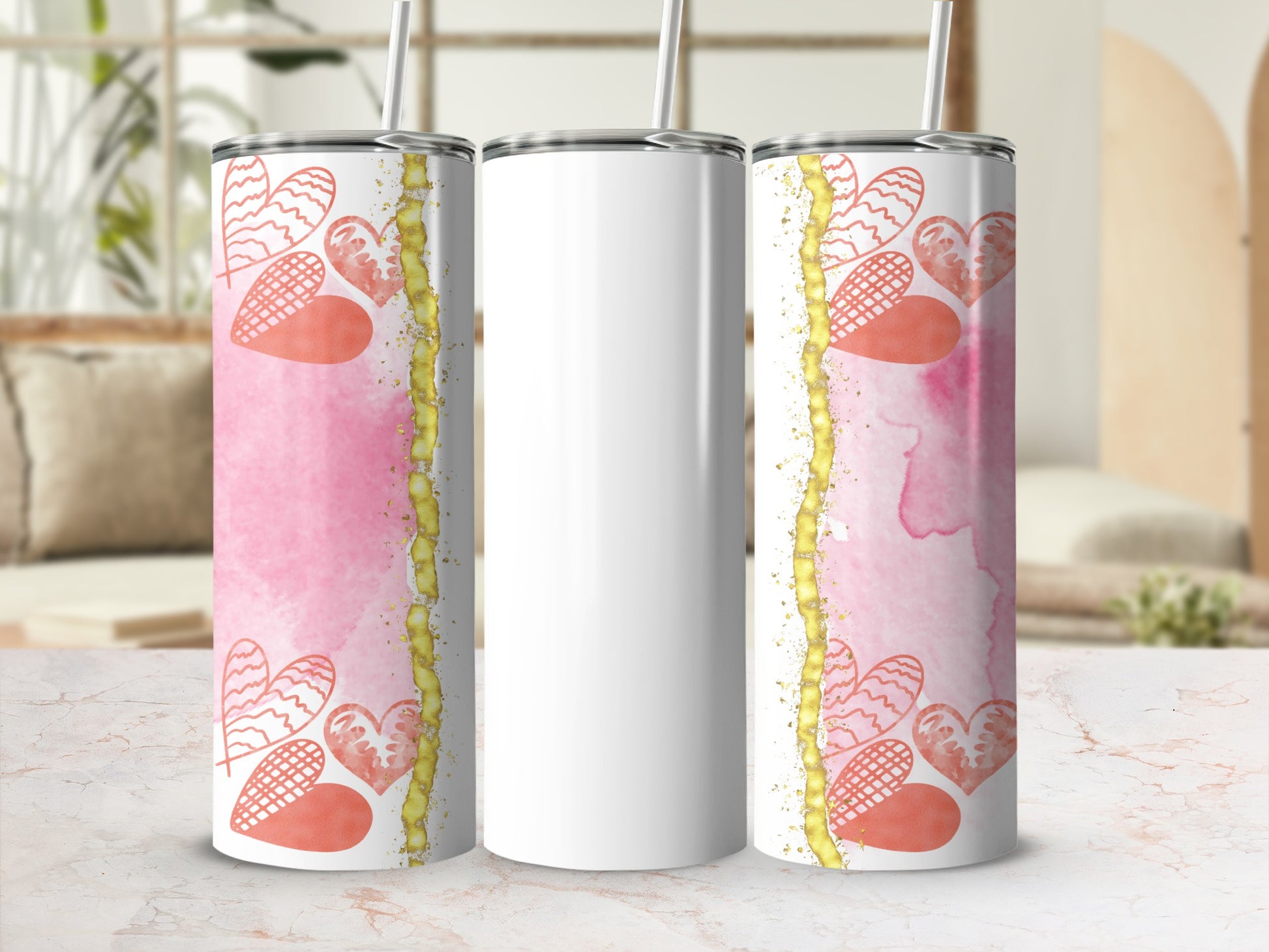 White tumbler with pink watercolor and heart design.