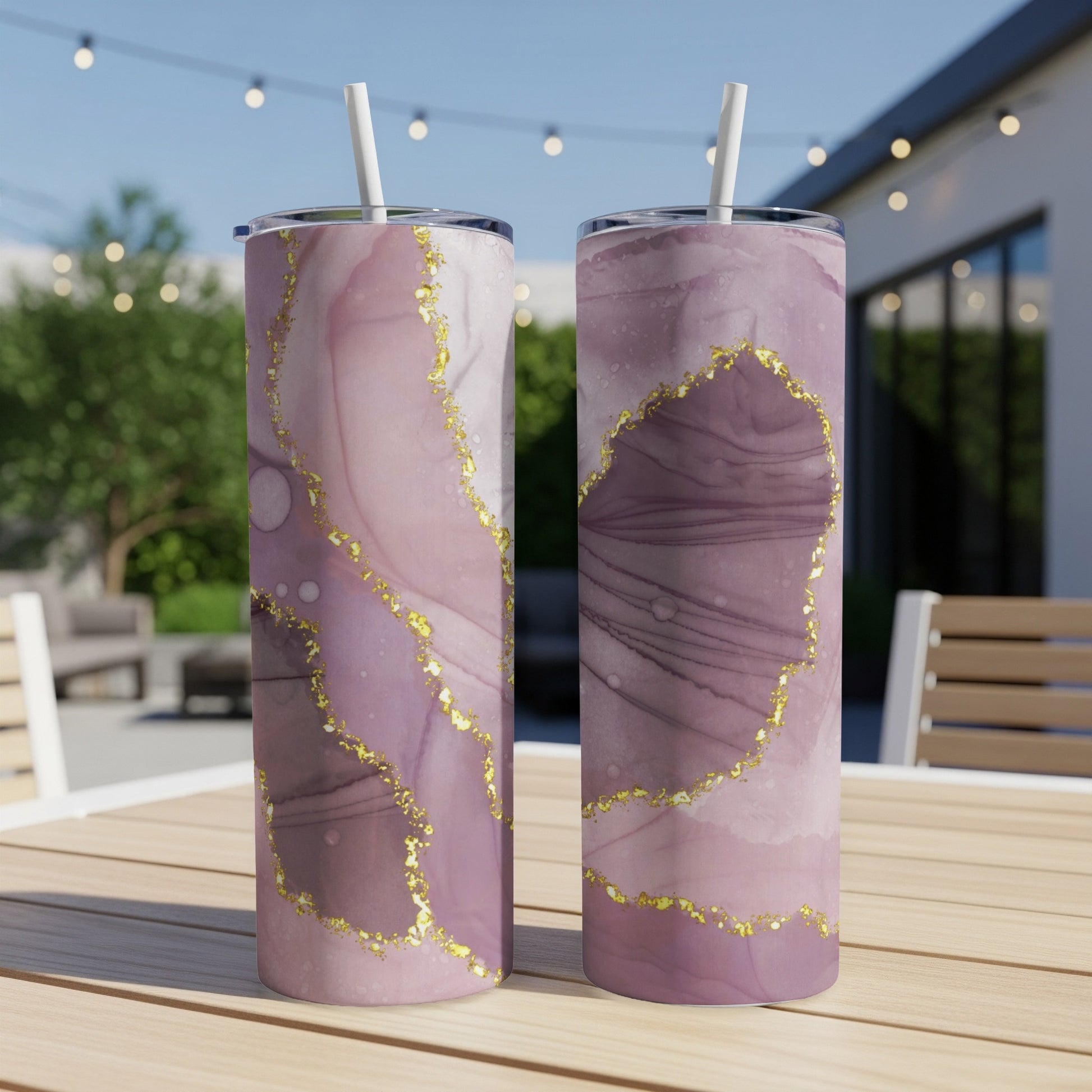 Two tall tumblers with pink and purple marble and gold accents.