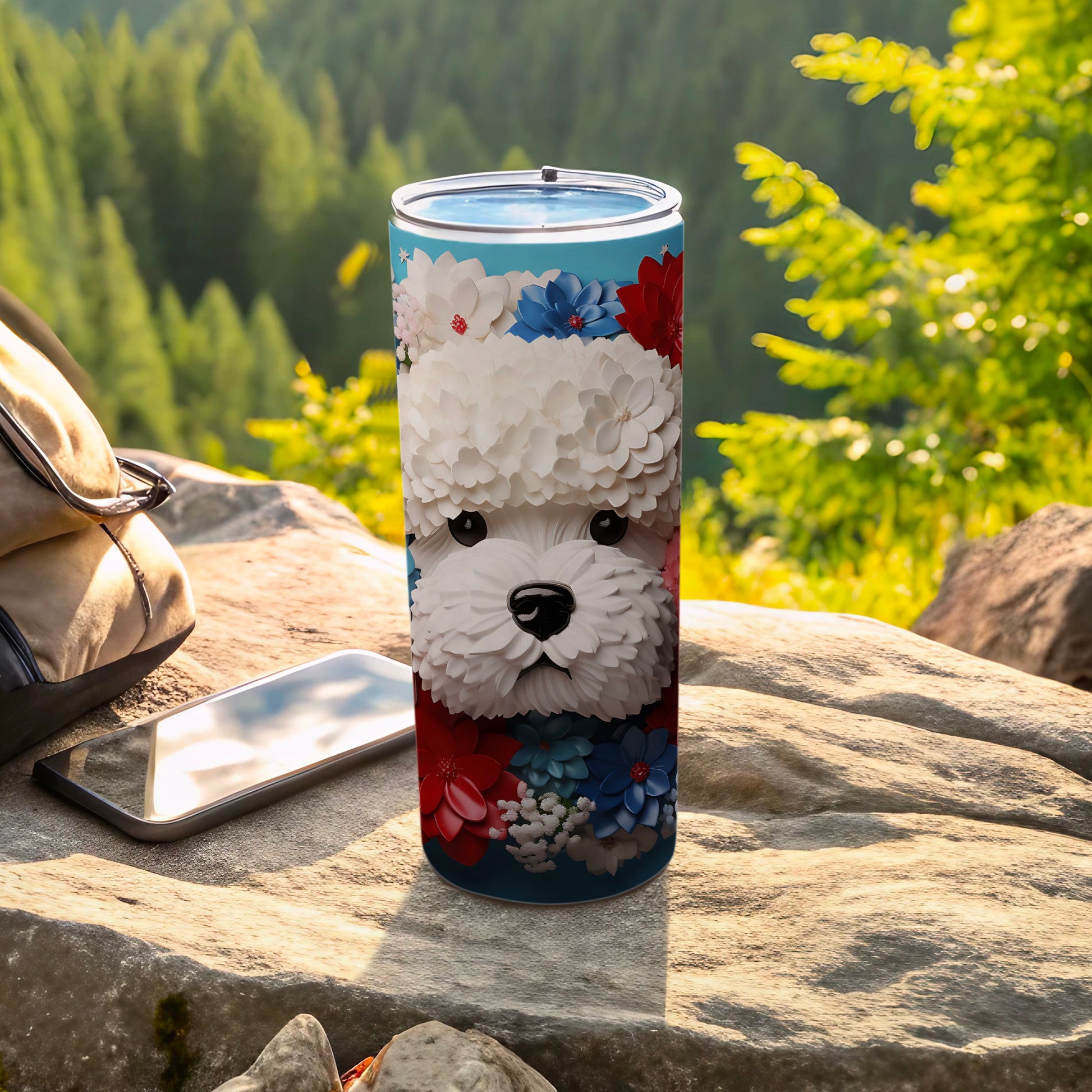 White fluffy dog face with red and blue floral pattern on a blue tumbler.