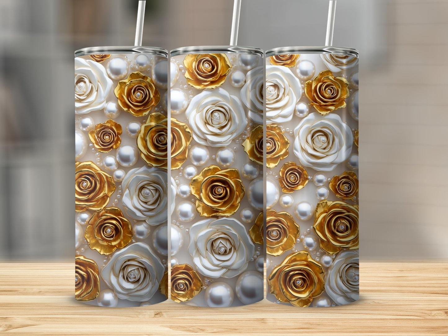 Three tumblers with a floral pattern of white and gold roses and pearls.