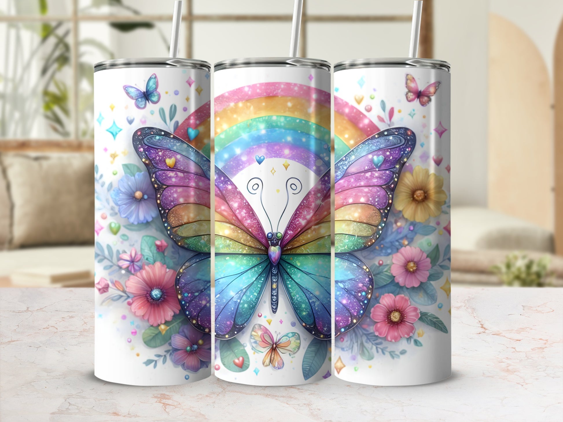 Three tumblers featuring a rainbow butterfly and floral design.