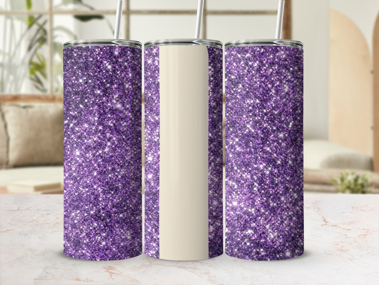 Three purple glitter tumblers with cream-colored sections, arranged on a marble surface.