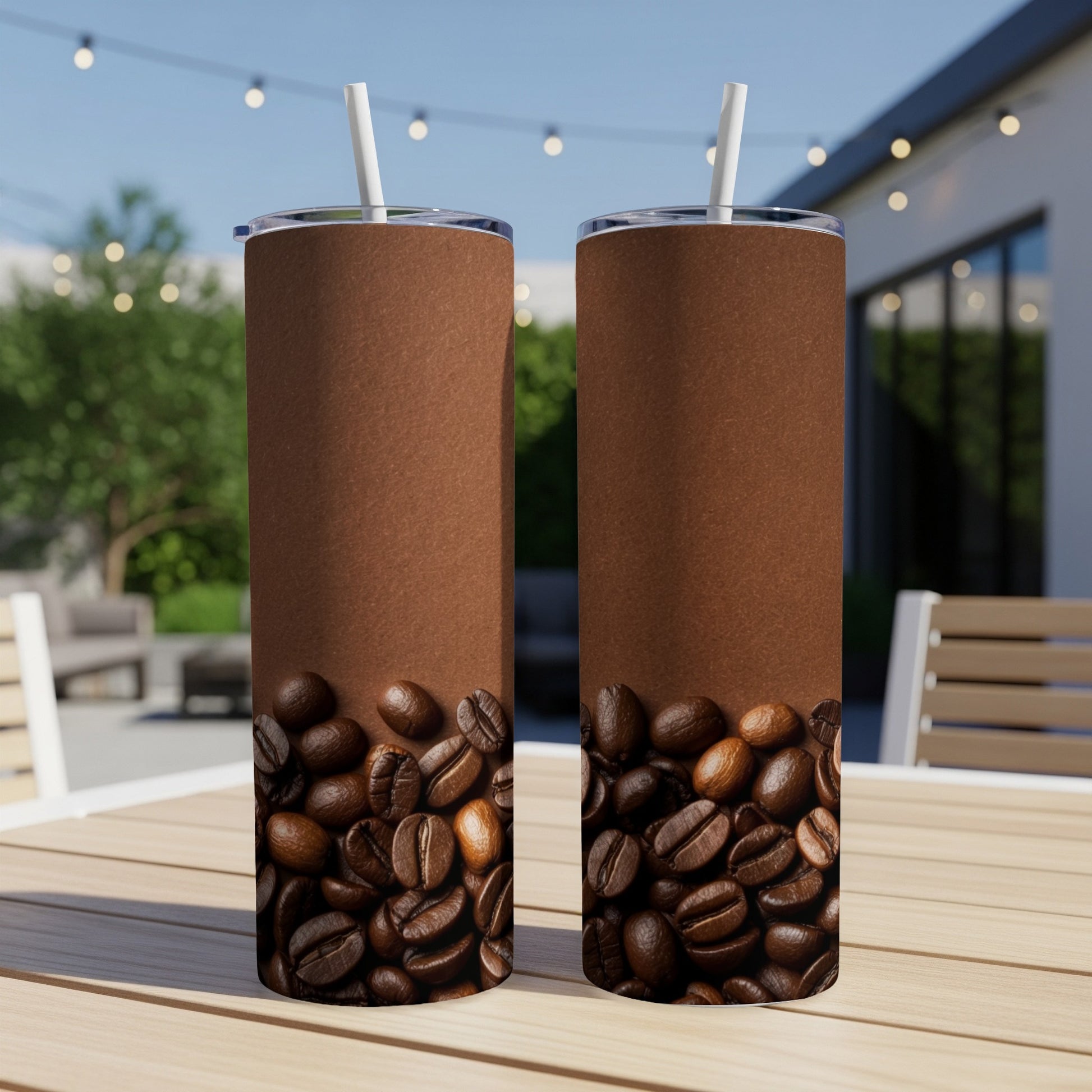 Two brown tumblers with coffee beans at the bottom, outdoors.