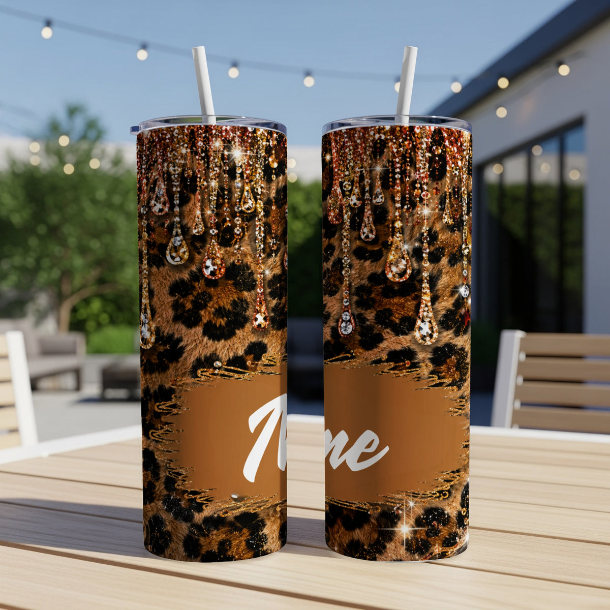 Two leopard print tumblers with dripping rhinestone accents and a "Love" design.