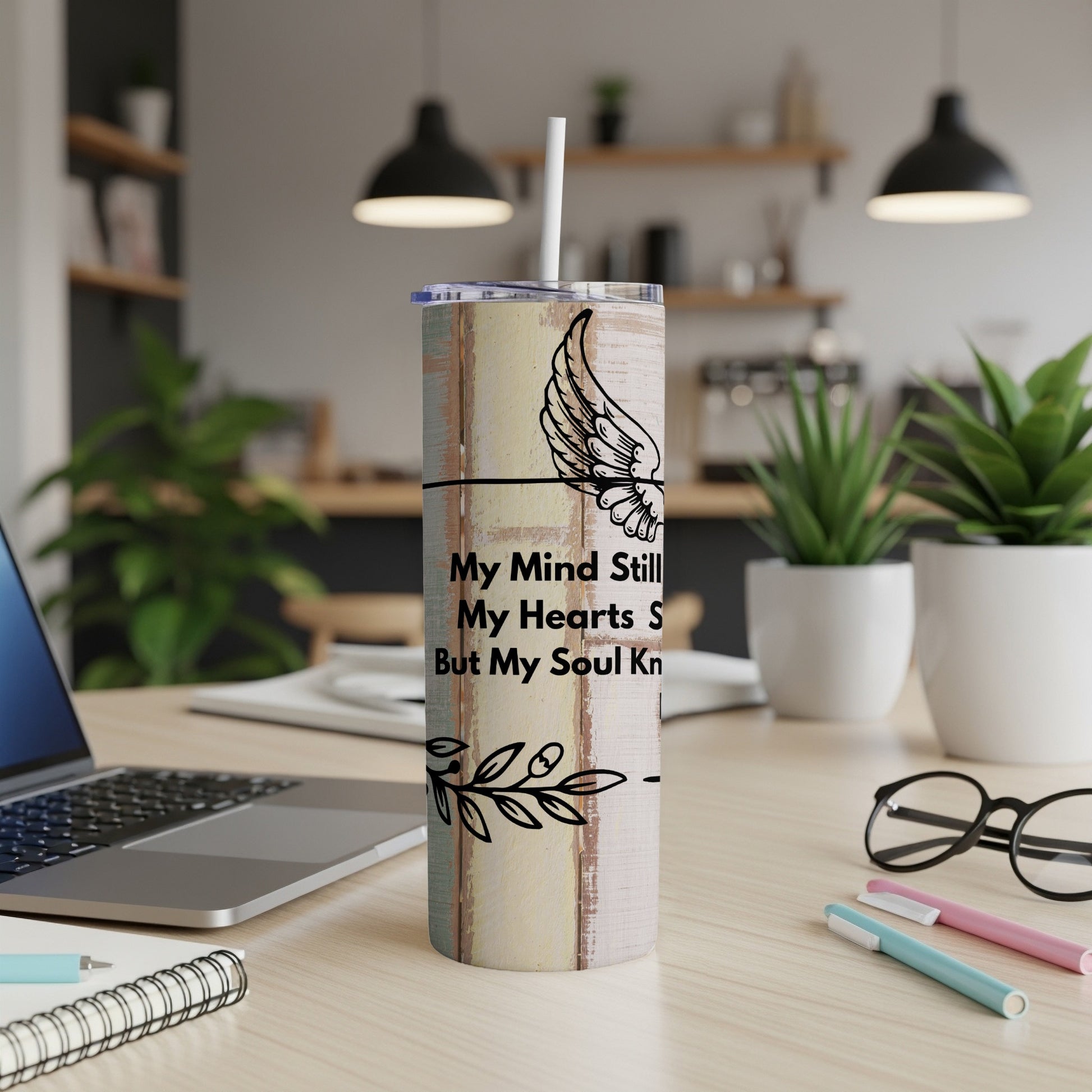 Tumbler with angel wing design and quote, "My Mind Still, My Hearts S, But My Soul Kn".