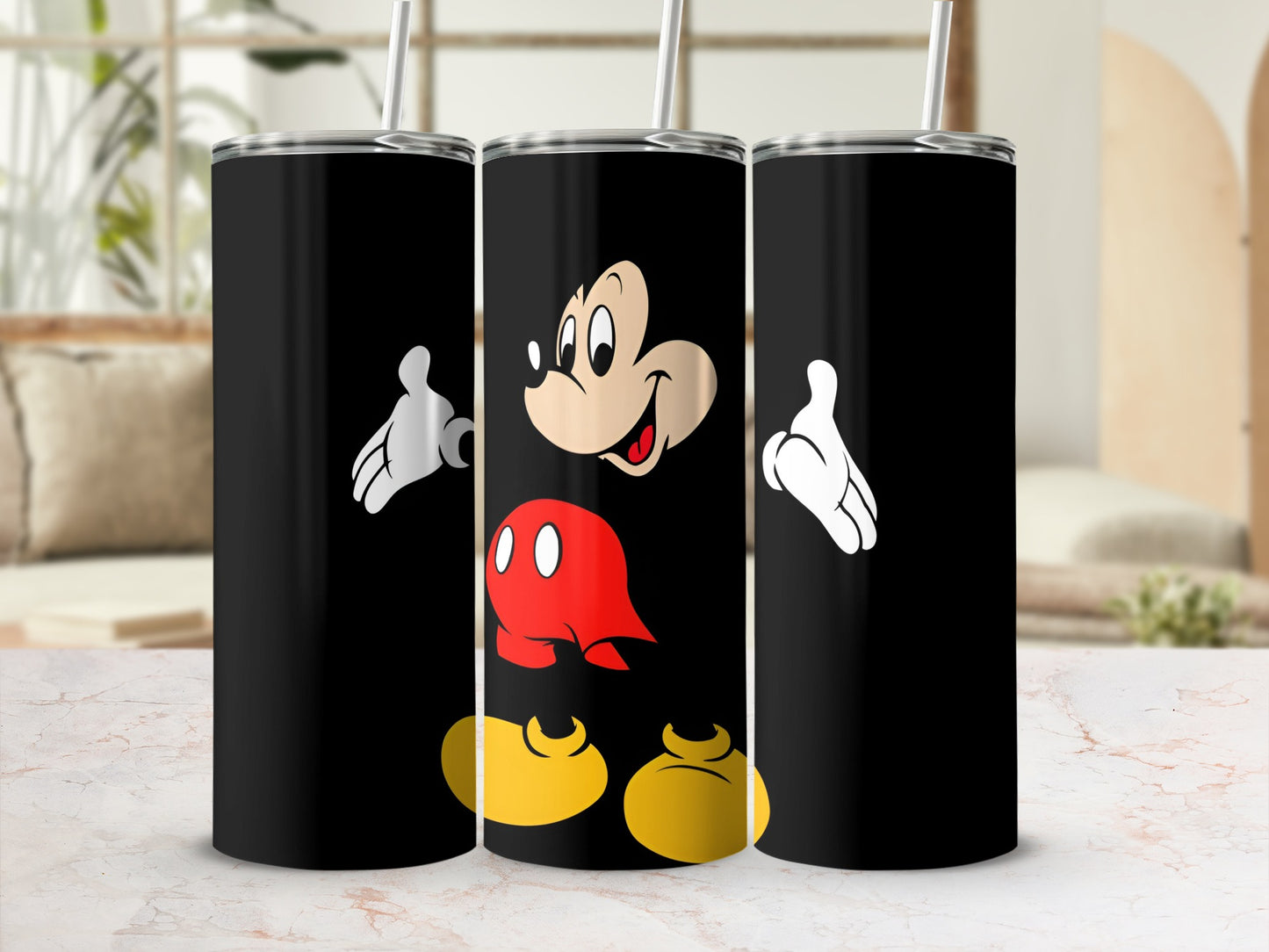 Black tumbler featuring Mickey Mouse graphic and straw.