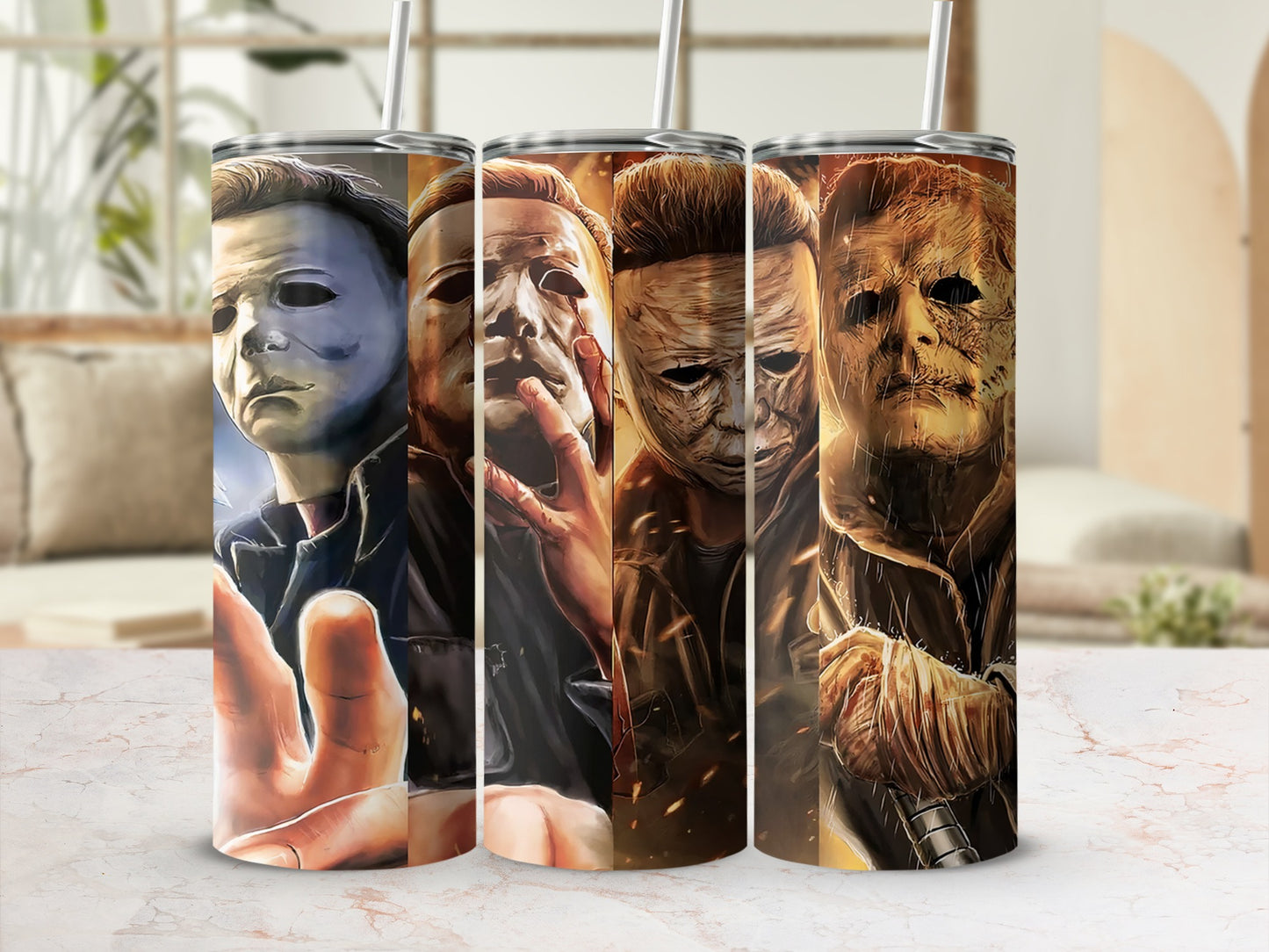 Three Michael Myers tumbler cups featuring his mask and hand.