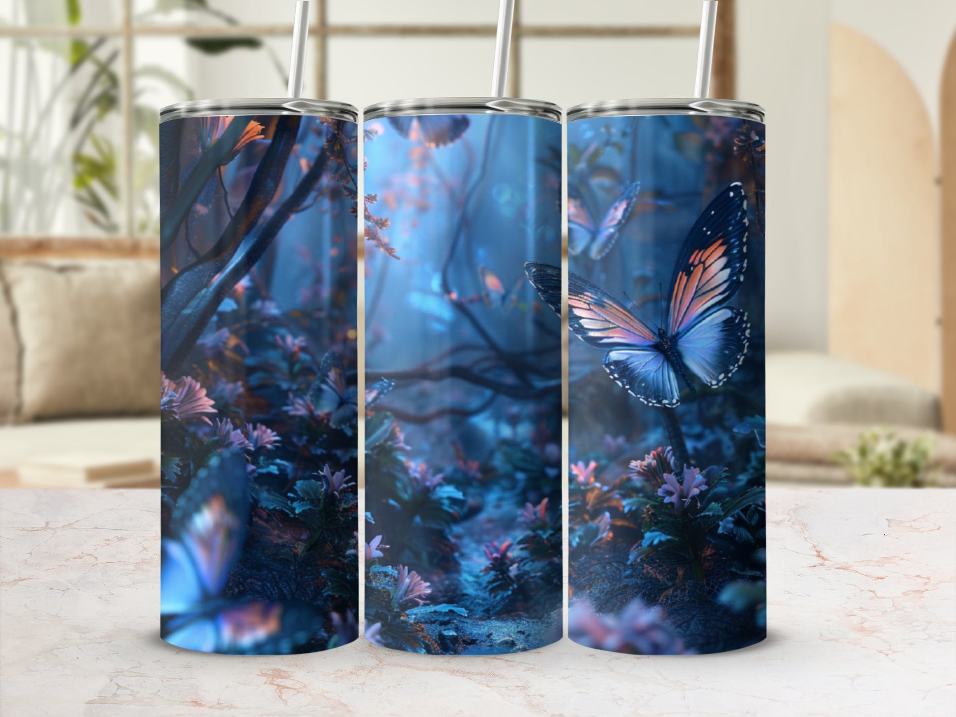 Three tumblers with a blue forest and butterfly design.