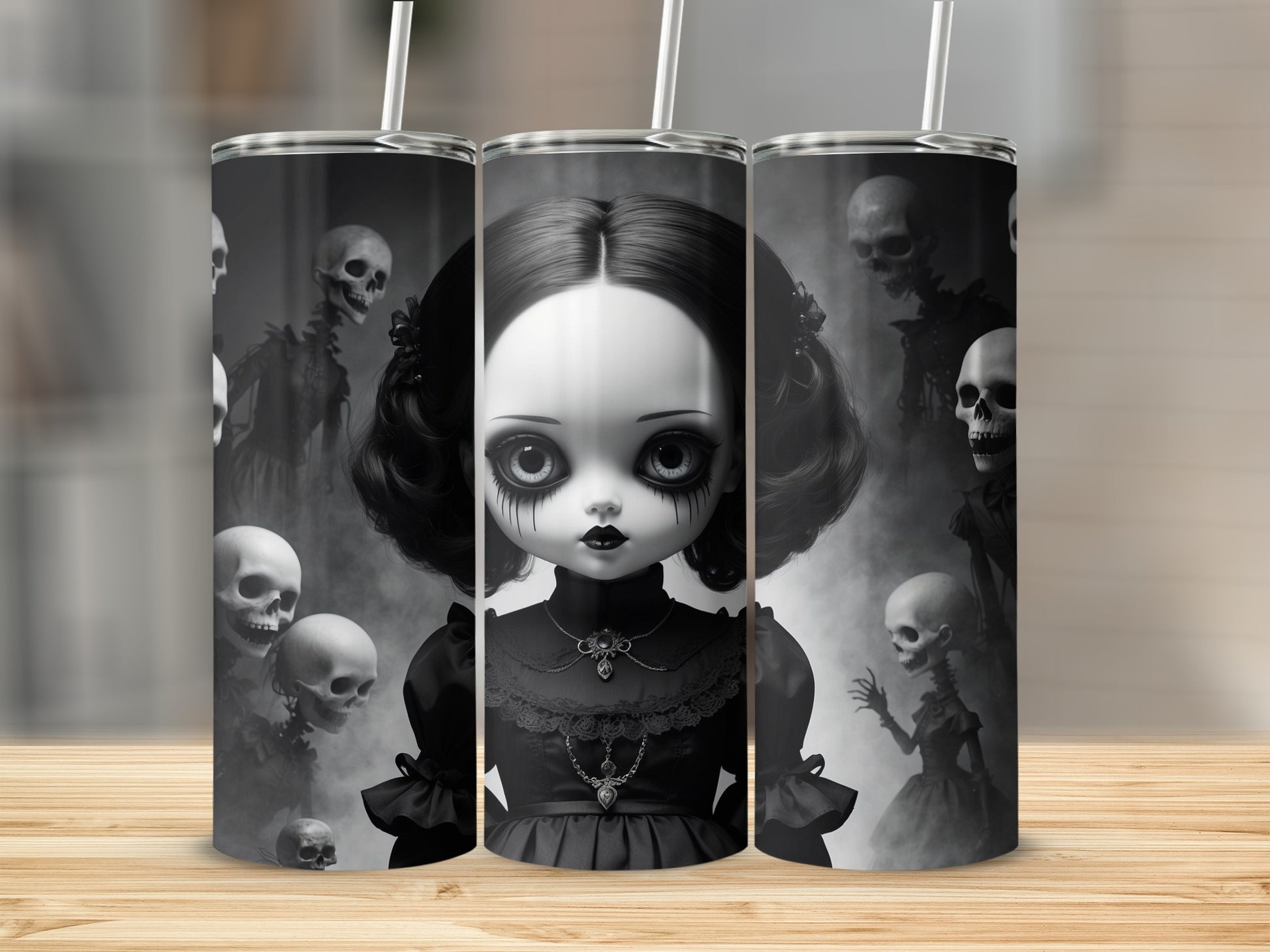 Gothic doll with spooky skulls and skeletons on a tumbler.