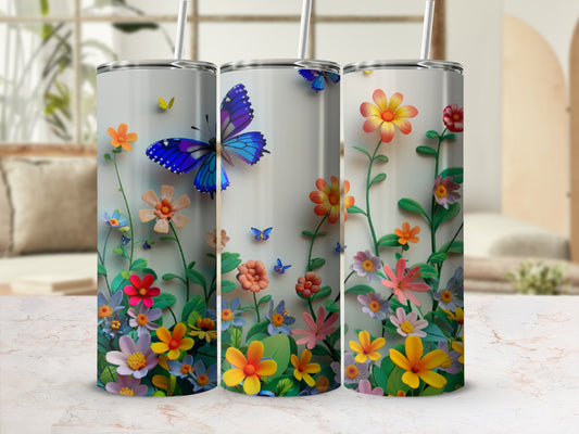 Three tumblers with a vibrant floral and butterfly design.