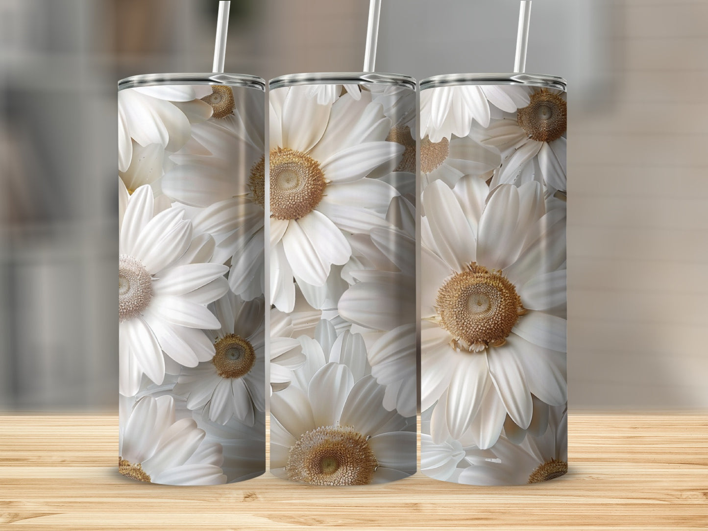 Three white daisy pattern tumblers on a wooden surface.
