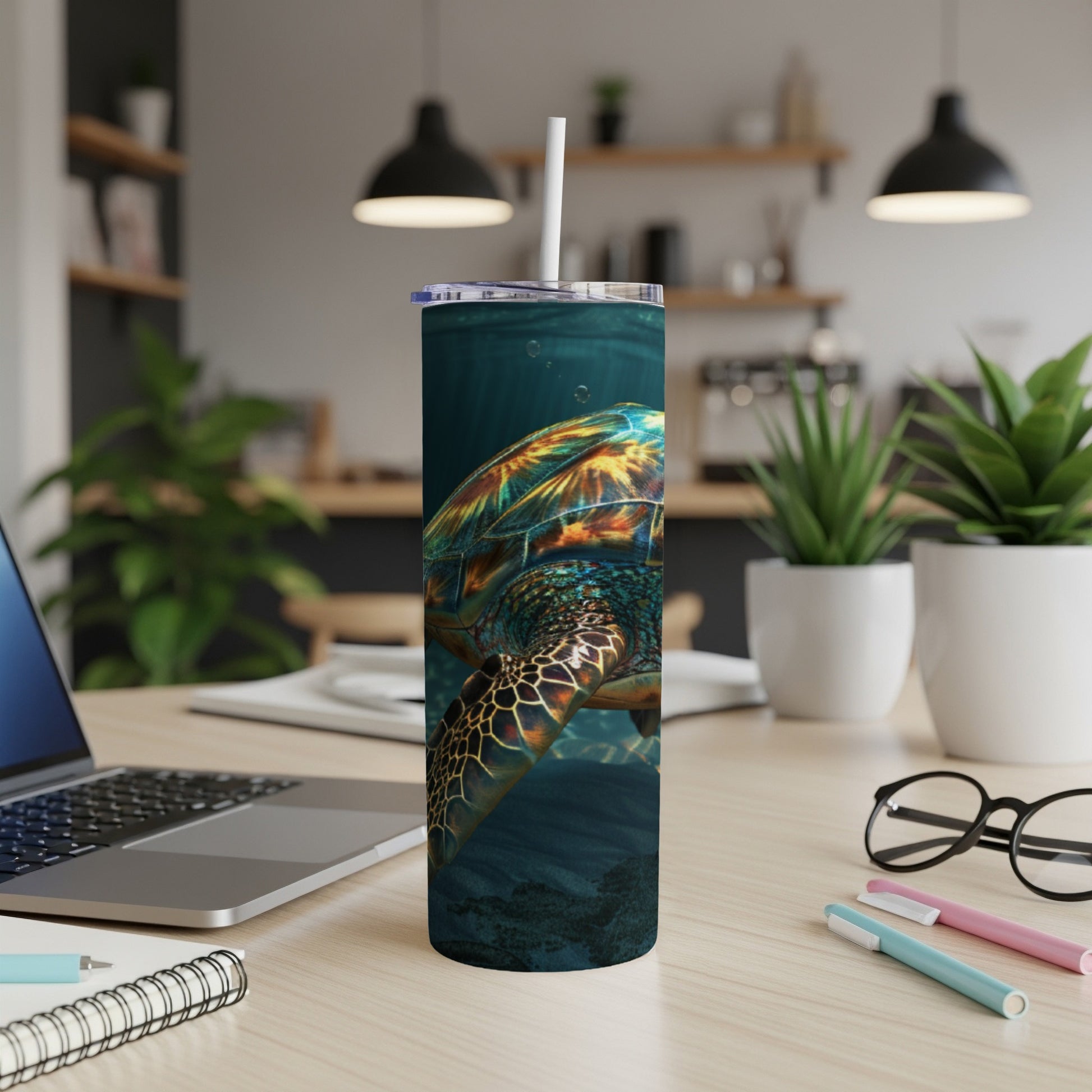 Sea turtle swimming underwater, close-up view, on a patterned tumbler.