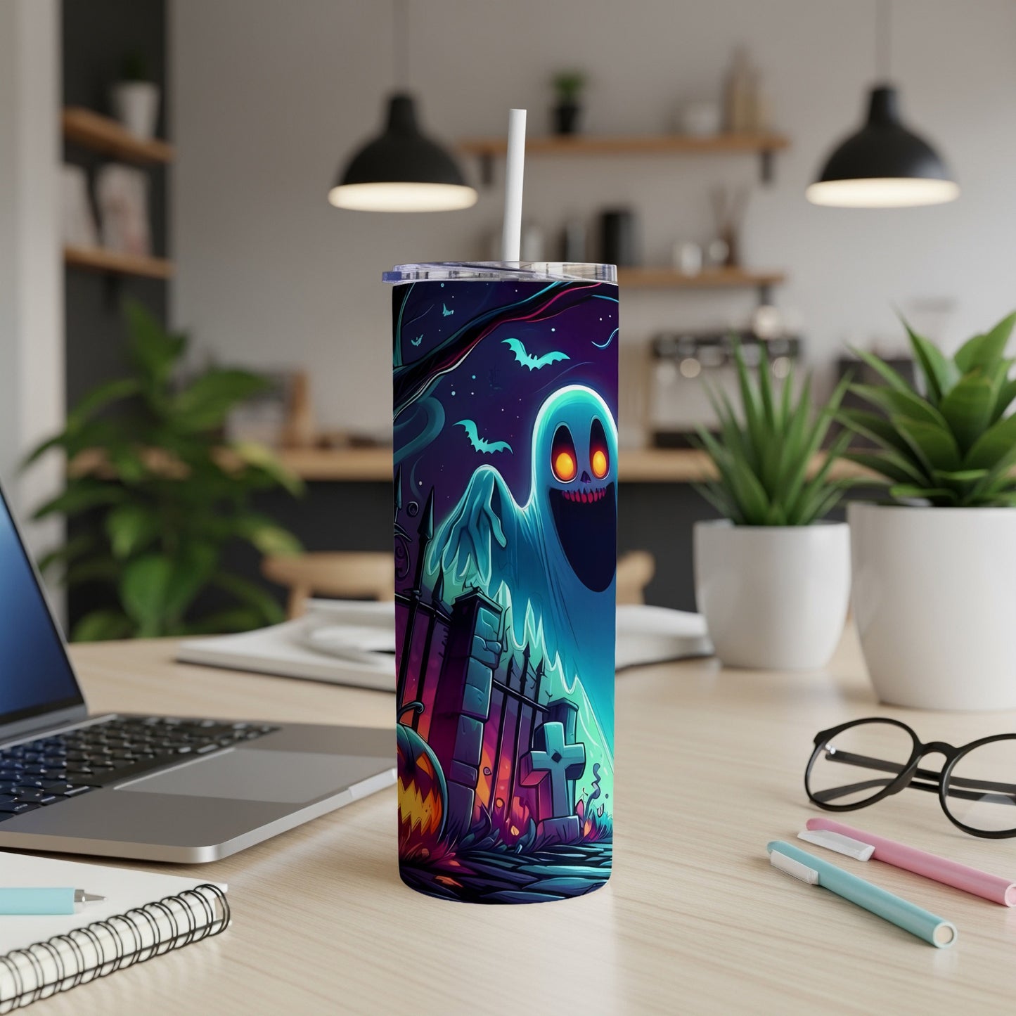 Halloween tumbler with ghost, bats, pumpkin, and graveyard scene design.