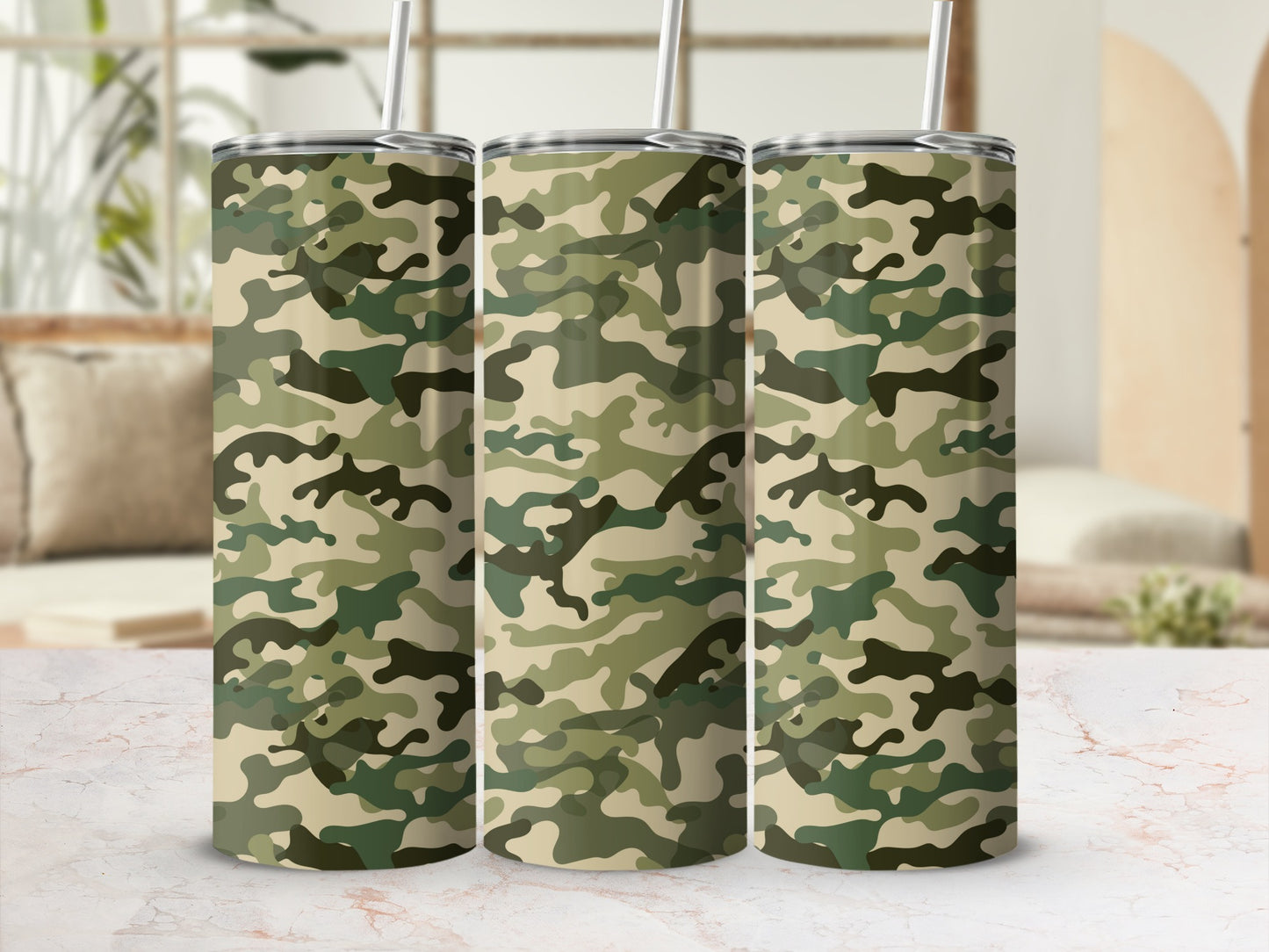 Three tumblers with a camouflage pattern and straws are shown.