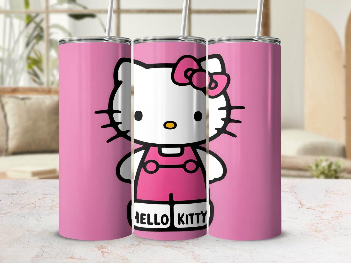 Hello Kitty in pink overalls on three pink tumblers with straws.