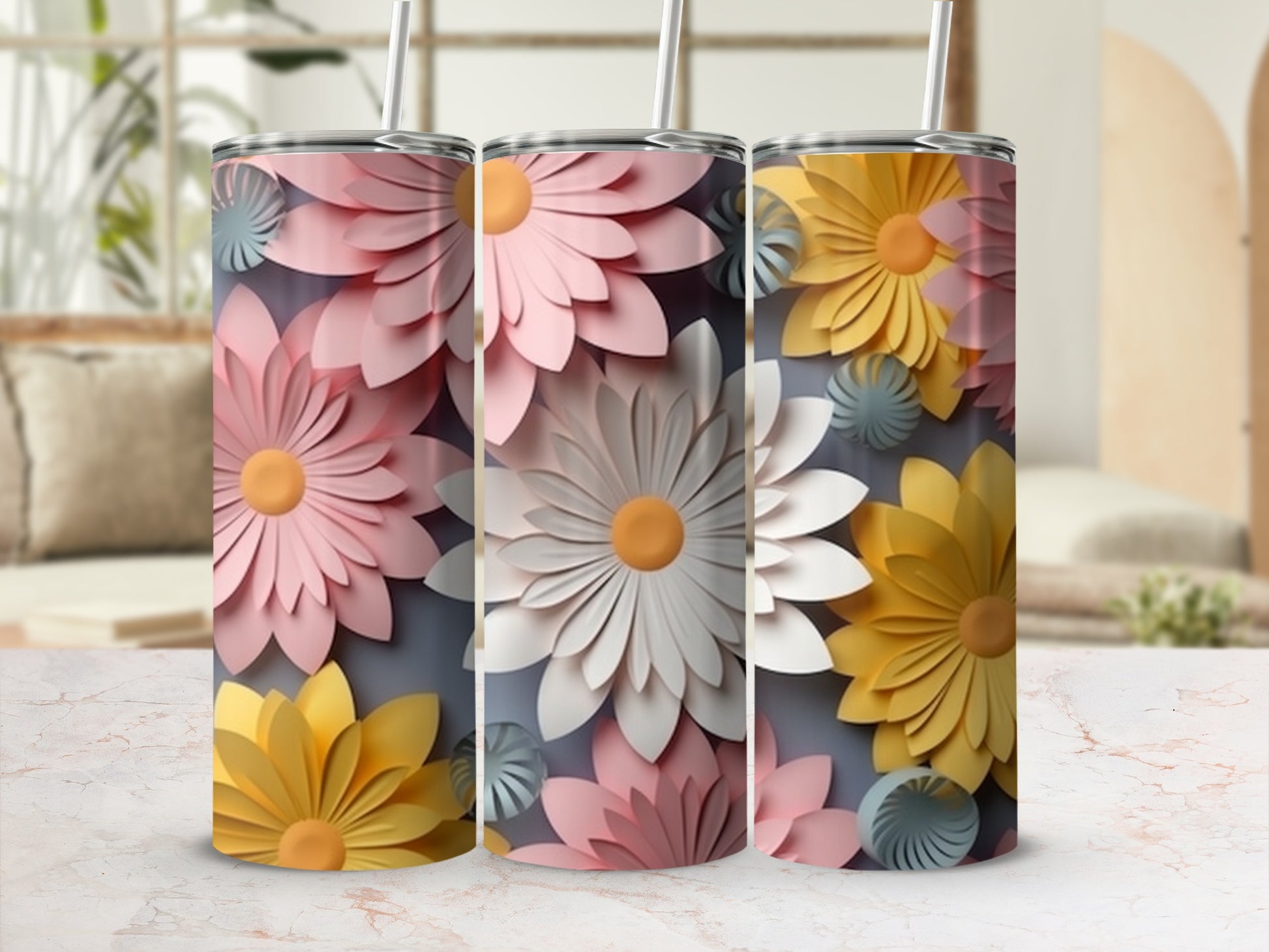 Three floral tumbler cups with pink, white, and yellow flowers on a light background.