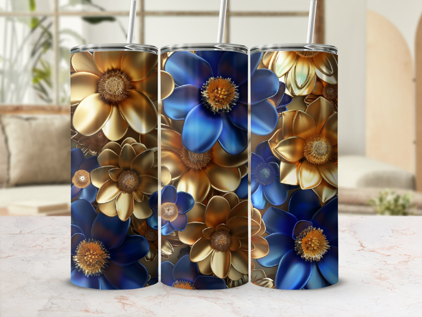 Three tall tumblers with metallic blue and gold floral designs.
