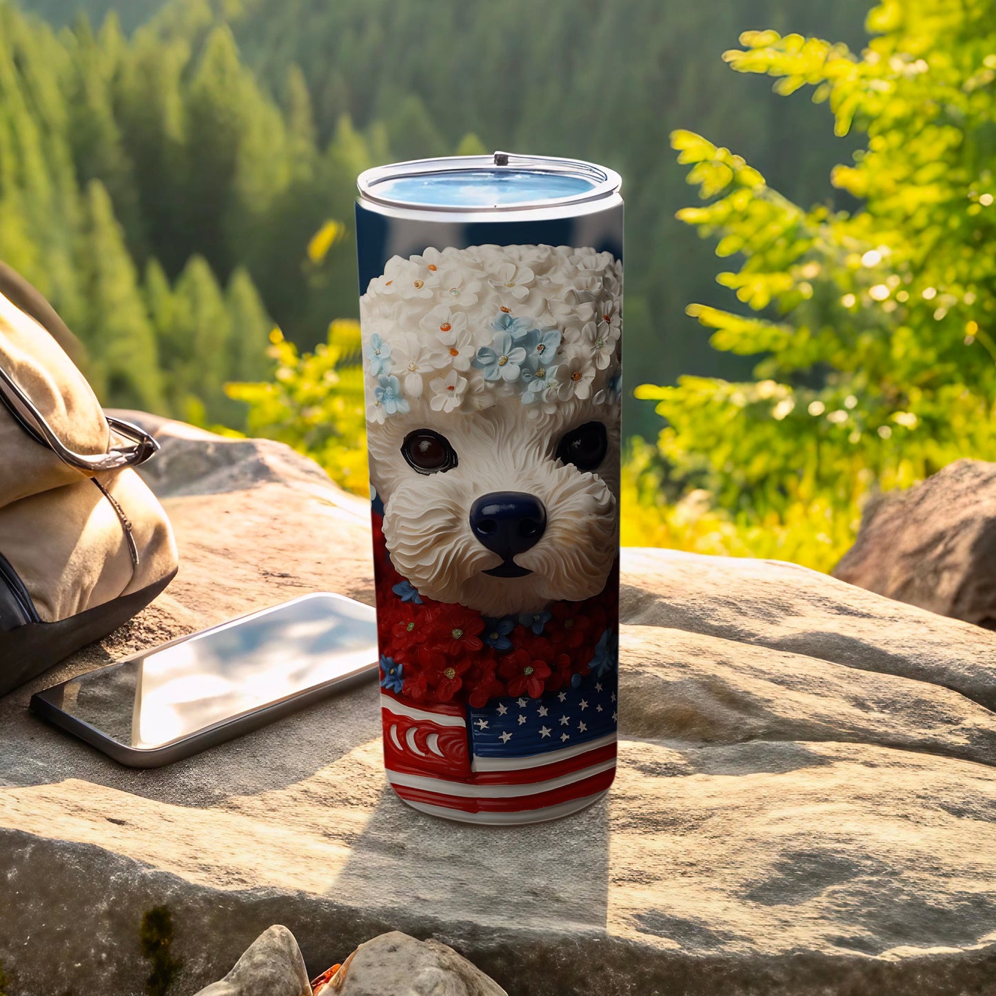 White fluffy dog with flowers and American flag pattern on a tumbler.