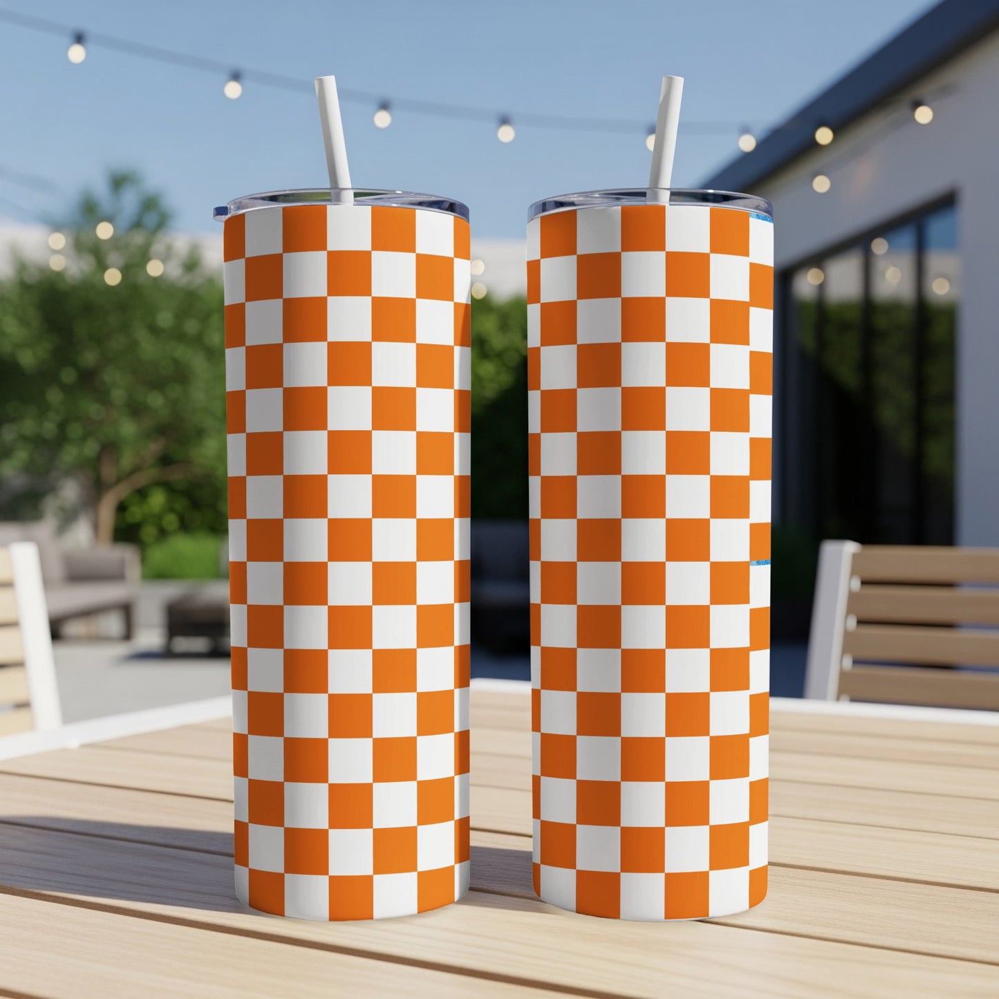 Two tall tumblers with orange and white checkered pattern.