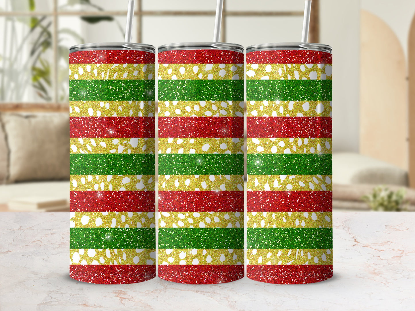 Three glittery tumblers with red, gold, and green horizontal stripes.