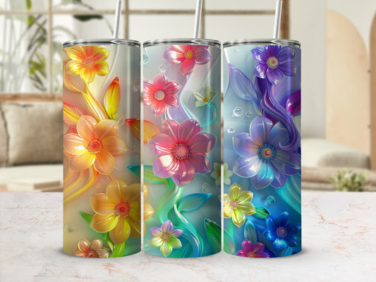 Three floral tumblers with colorful blooms and green leaves.