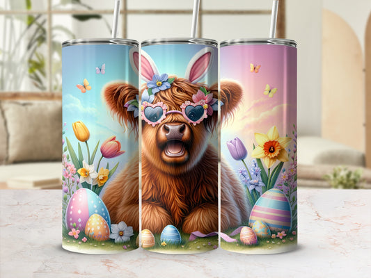 Highland cow with bunny ears and heart sunglasses, Easter eggs, and flowers on tumbler.