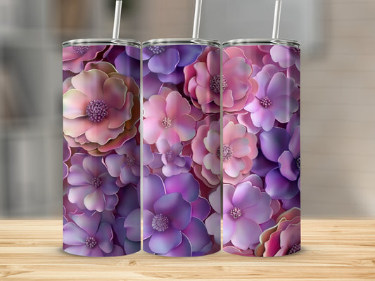 Three tumblers with a vibrant purple and pink floral design on a wooden surface.