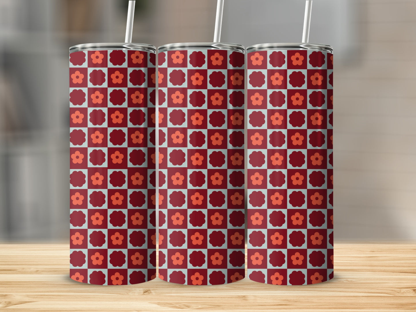 Three tumblers with a repeating maroon and light blue floral checkerboard pattern.