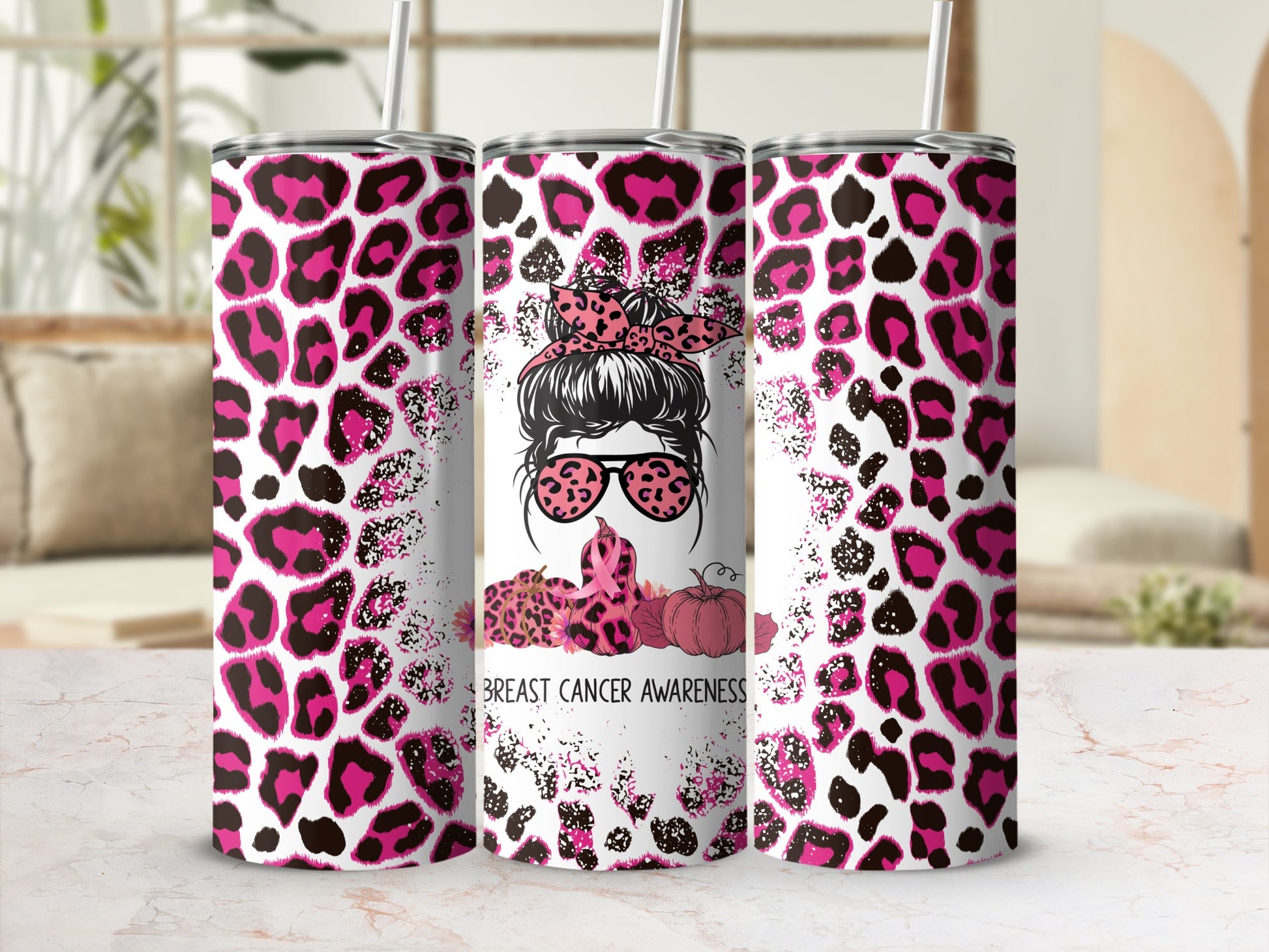 Pink leopard print tumbler with breast cancer awareness graphic.