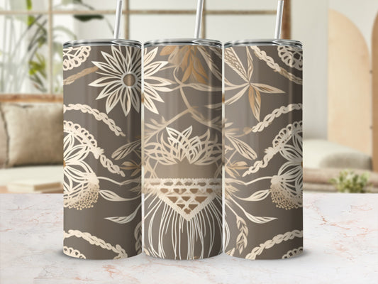 Three tumblers with floral and boho macrame patterns on a marble surface.