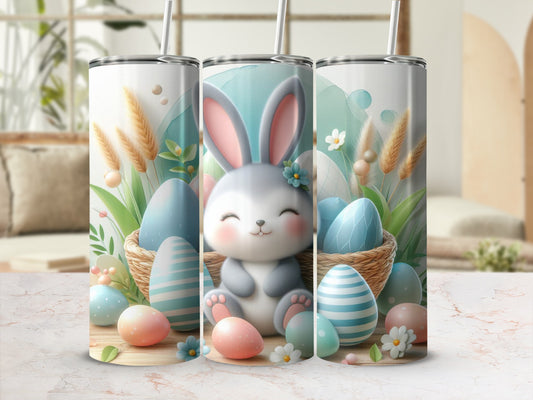Cute Easter bunny with colorful eggs and floral accents on a tumbler.