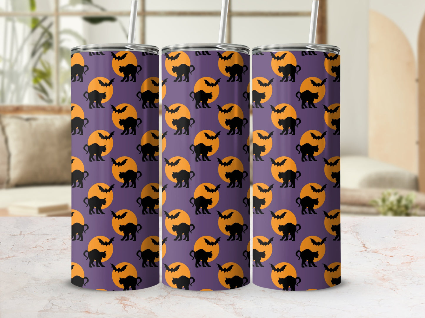 Tumblers with a Halloween pattern of black cats, bats, and orange moons on purple.