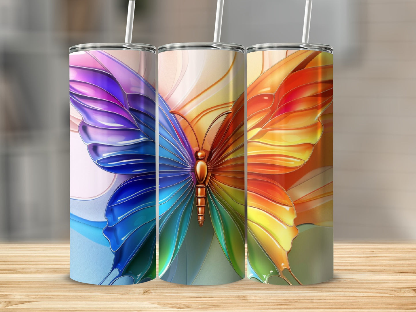 Three tumblers featuring a colorful stained-glass butterfly design.