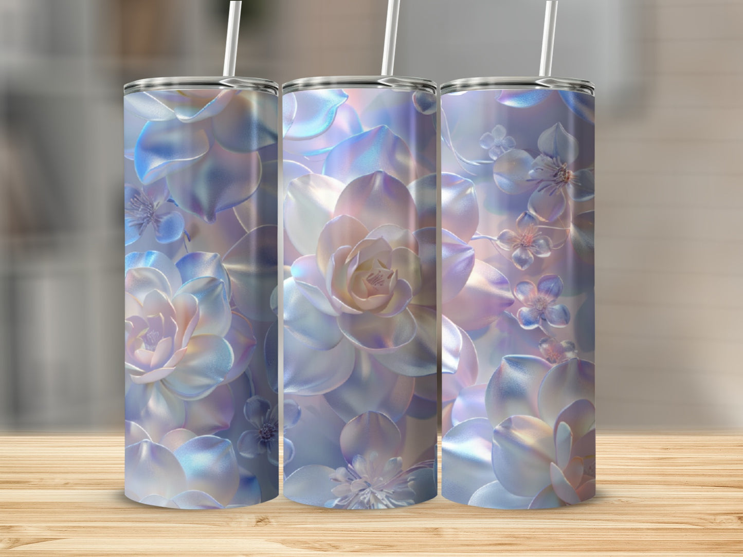 Three iridescent tumblers with a floral pattern on a wooden surface.