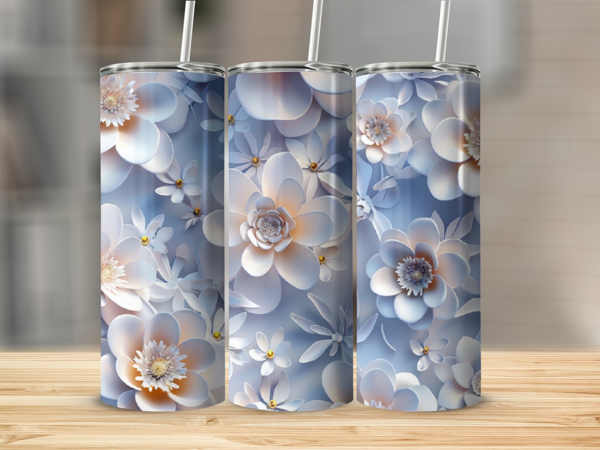 Three tall tumblers with white and blue floral patterns.