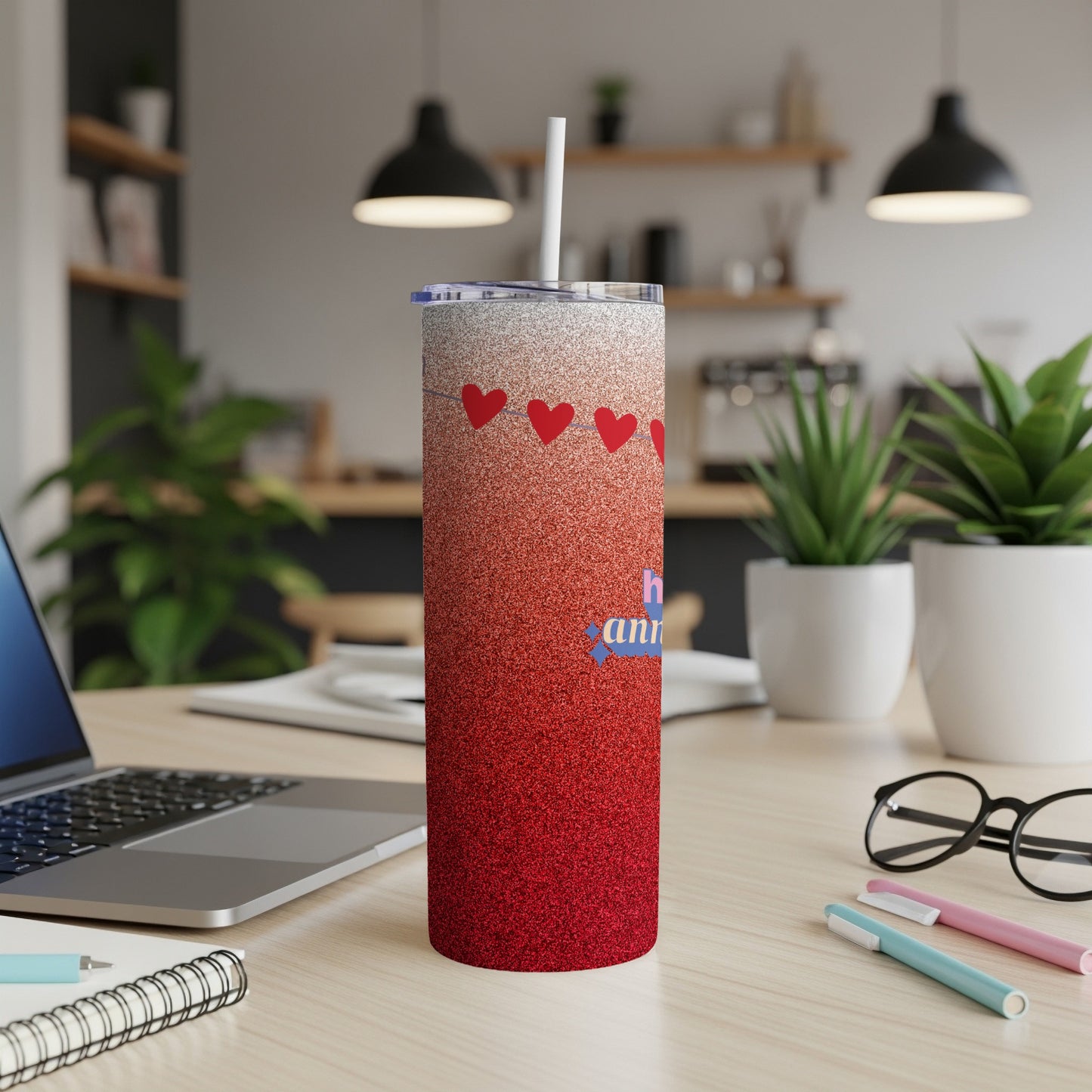 Red and white glitter tumbler with hearts and "anniversary" text.
