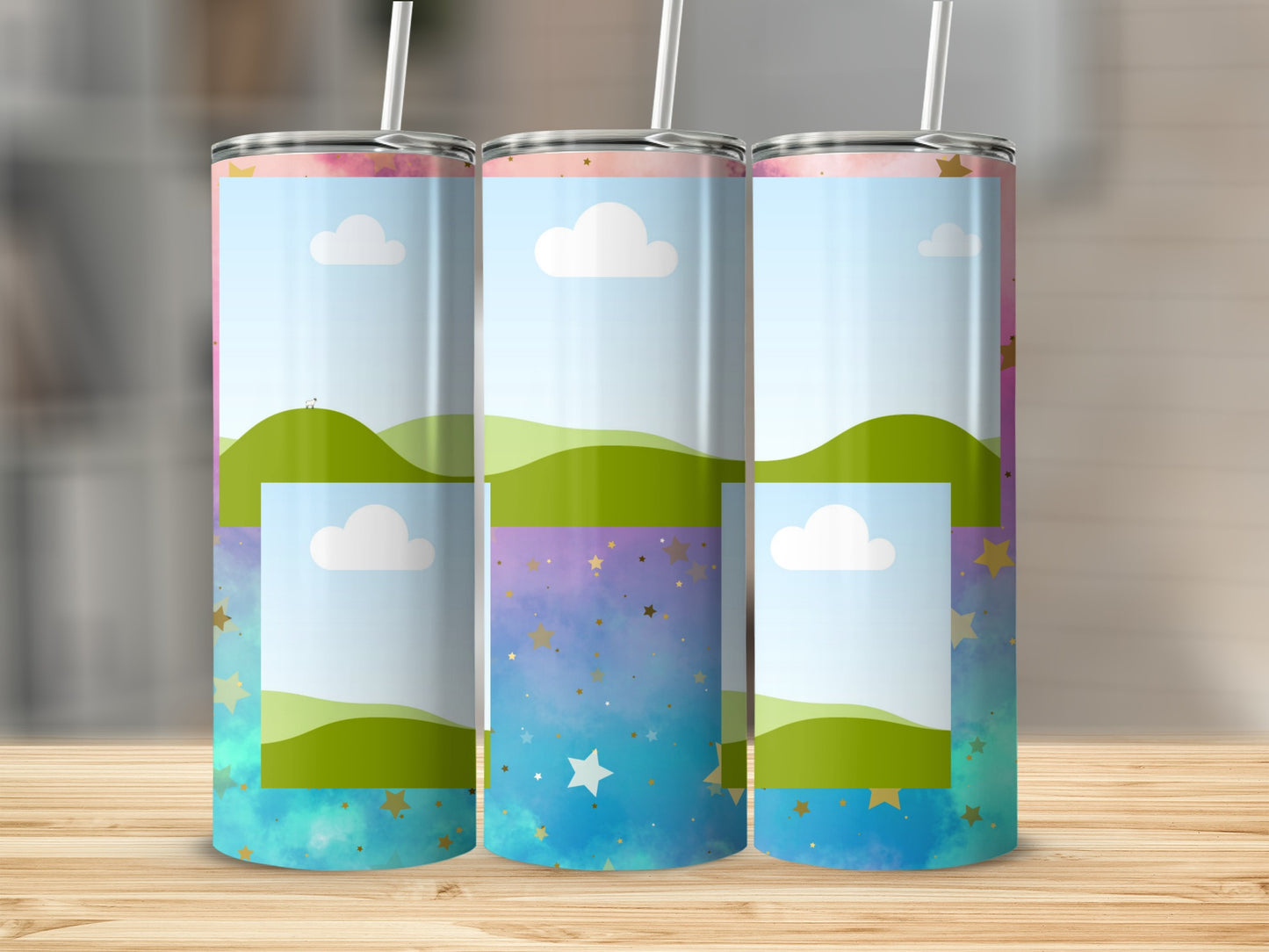Three tumblers with a whimsical landscape and starry sky design.
