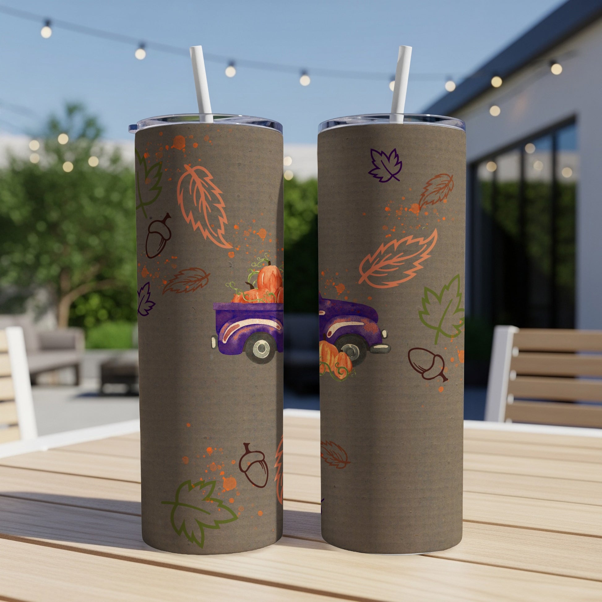 Purple truck with pumpkins and fall leaves design on two tumblers.
