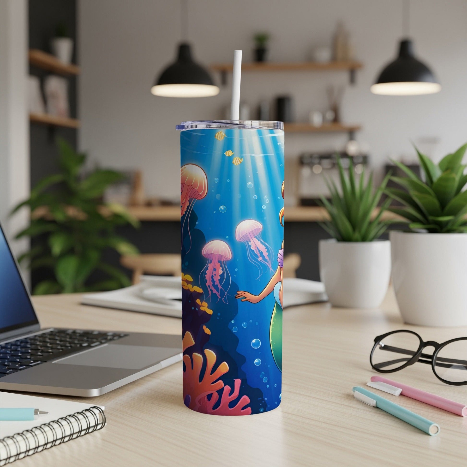 Mermaid and jellyfish in underwater scene on a stainless steel tumbler.