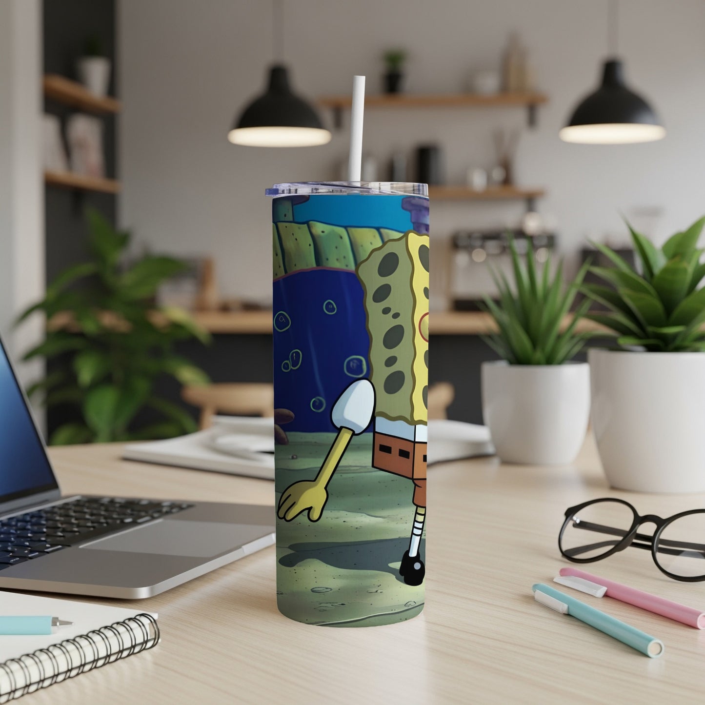 SpongeBob SquarePants on a skinny tumbler with a straw.