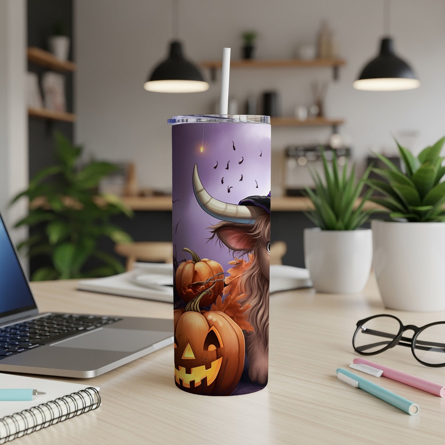 Tall tumbler with Halloween highland cow, pumpkins, and falling bats design.