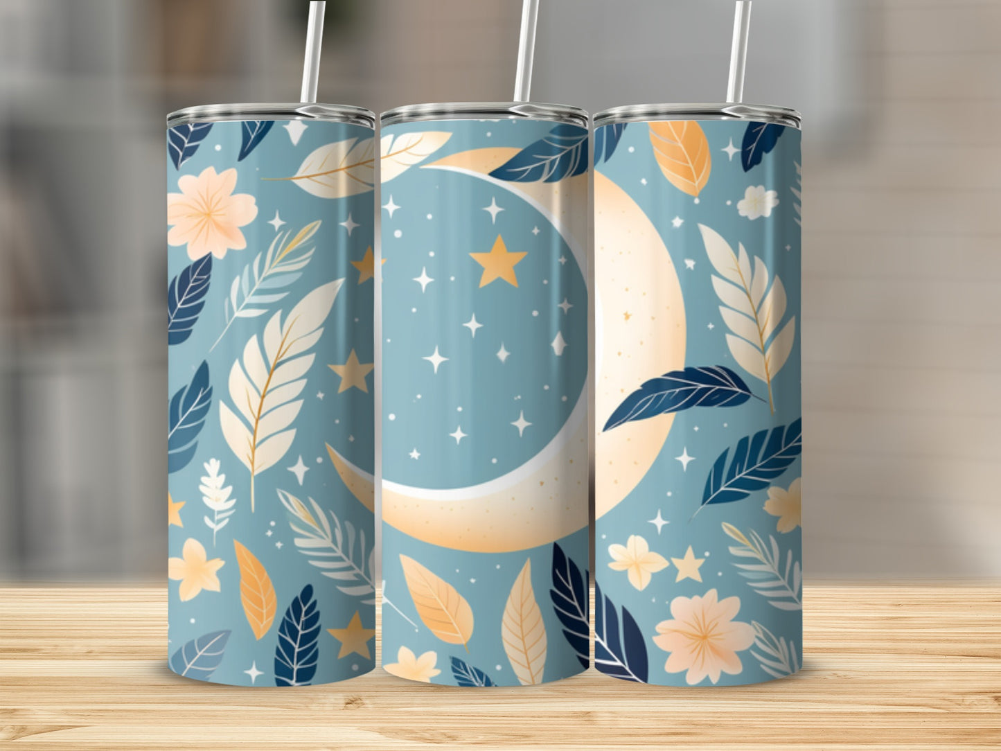 Blue tumbler with crescent moon, stars, and floral leaf pattern.