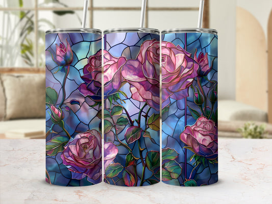 Three tumblers with stained glass rose design on marble surface.