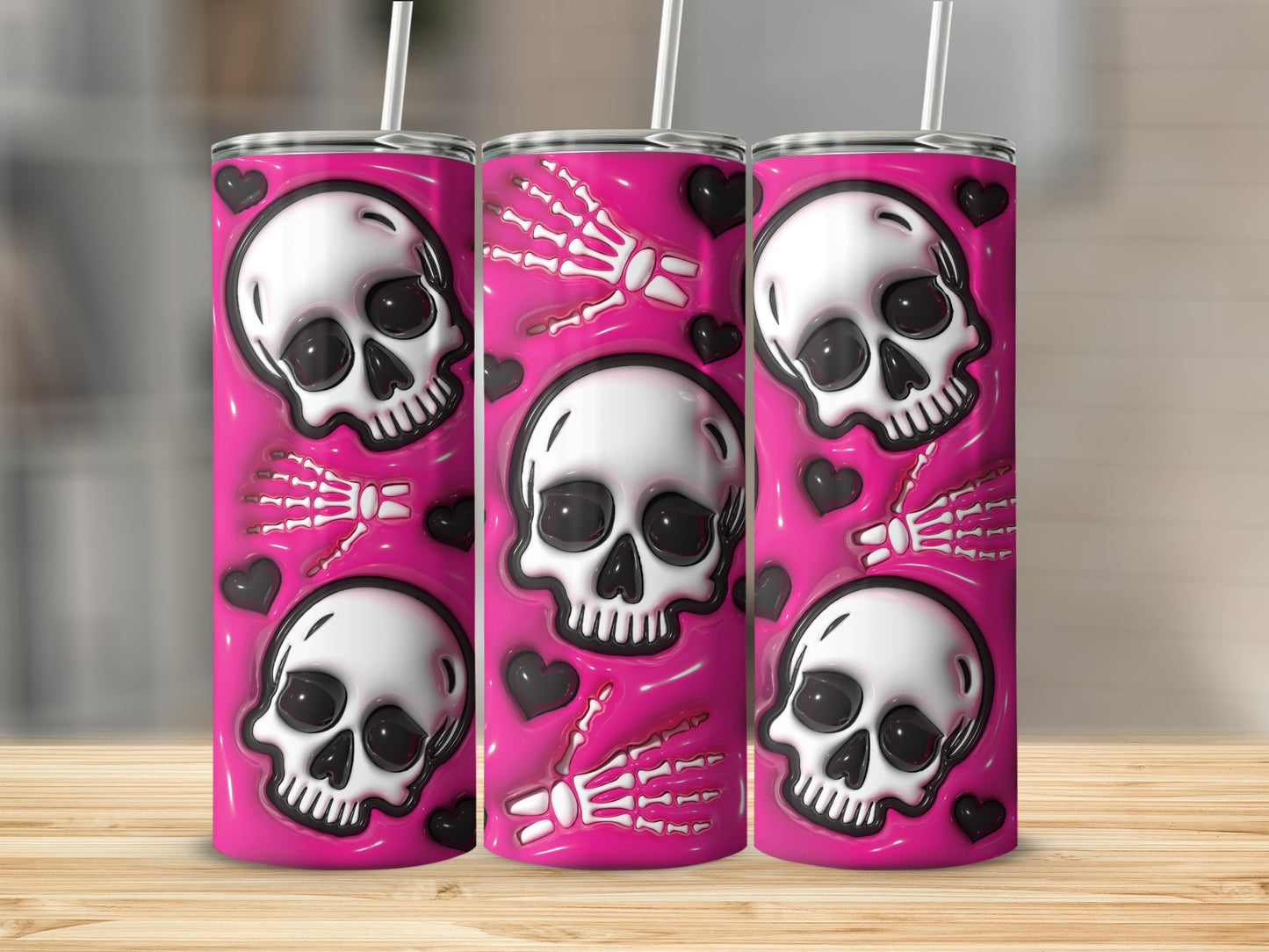 Pink tumbler with repeating pattern of skulls, skeletons' hands, and black hearts.