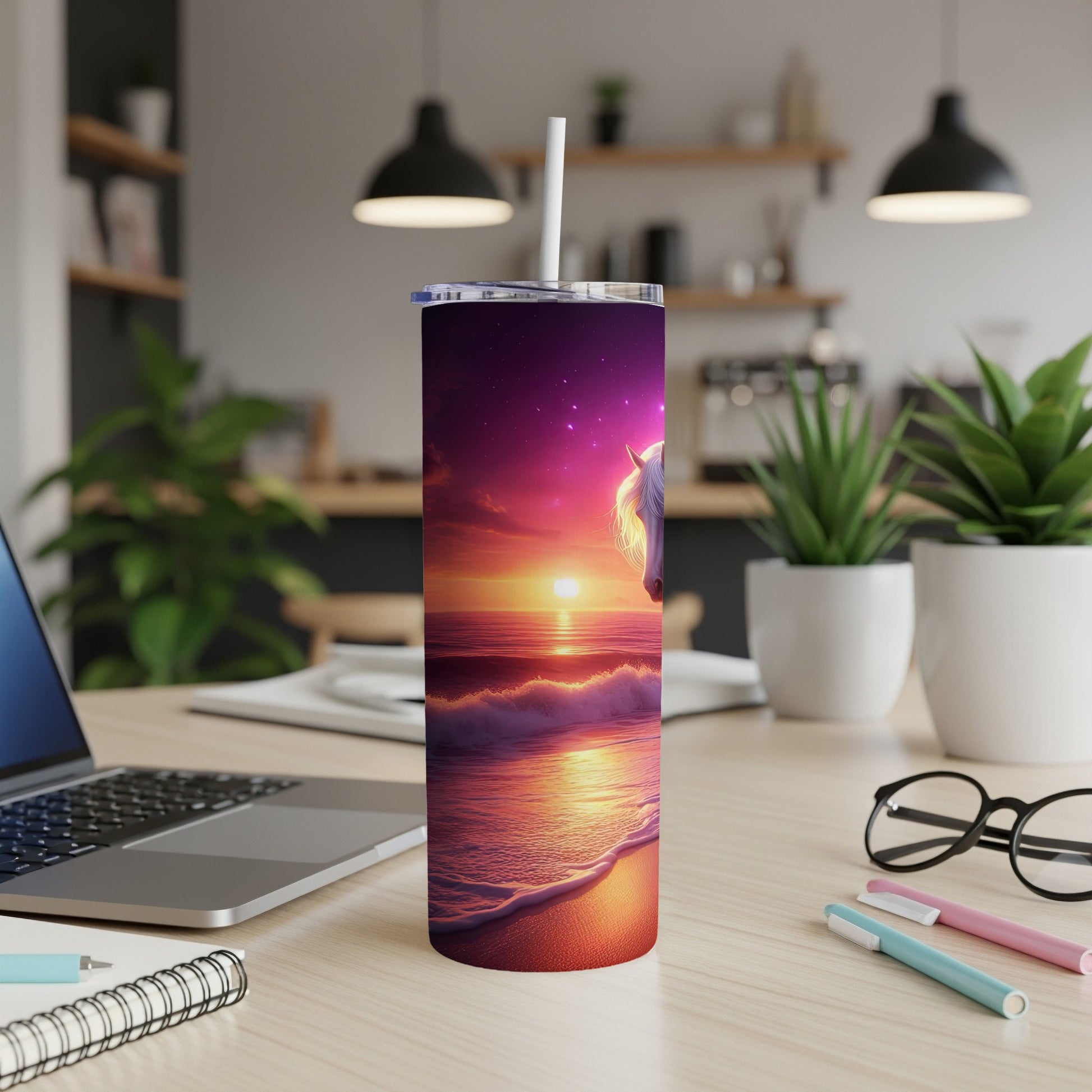Horse and sunset design on a white tumbler with straw on a desk.