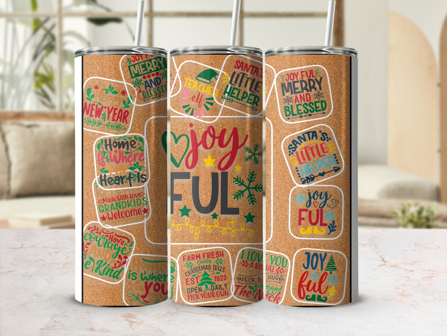 Cork tumbler with holiday-themed designs and text, including "Joyful" and "Merry & Blessed".