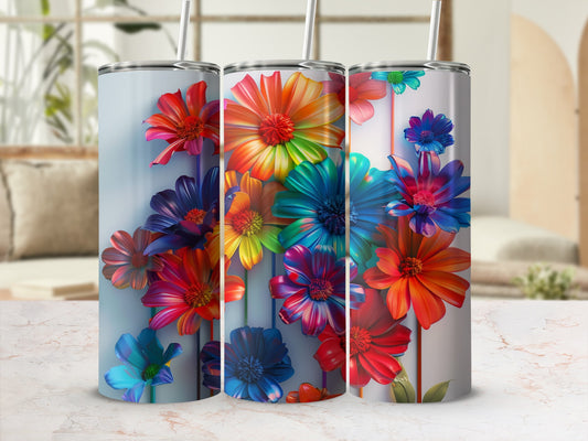 Three tumblers with colorful, abstract floral designs on a marbled surface.